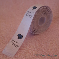 http://www.easysewingforbeginners.com/project/make-fabric-labels-home/