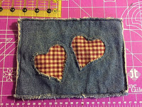 http://hangryfork.com/sewing-projects/reverse-applique-upcycled-denim-potholder/