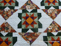 https://frommycarolinahome.wordpress.com/2015/12/30/reworking-the-cottage-garden-quilt/