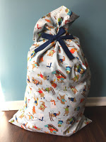 http://www.marymarthamama.com/crafty-cat/santa-bag-tutorial/