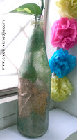 http://creativekhadija.com/2015/10/upcycled-bottle-diy-for-fall-decoration/