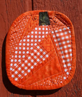 http://www.patchworkposse.com/fall-pumpkin-mug-rug-tutorial/