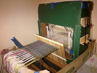 https://susaweaving.wordpress.com/2015/07/08/weaving-is-for-everyone-how-to-build-a-cardboard-and-bamboo-4-shaft-weaving-loom/