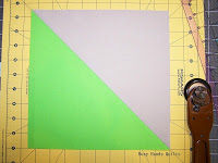 http://busyhandsquilts.blogspot.com/2015/05/squaring-half-square-triangles-tutorial.html