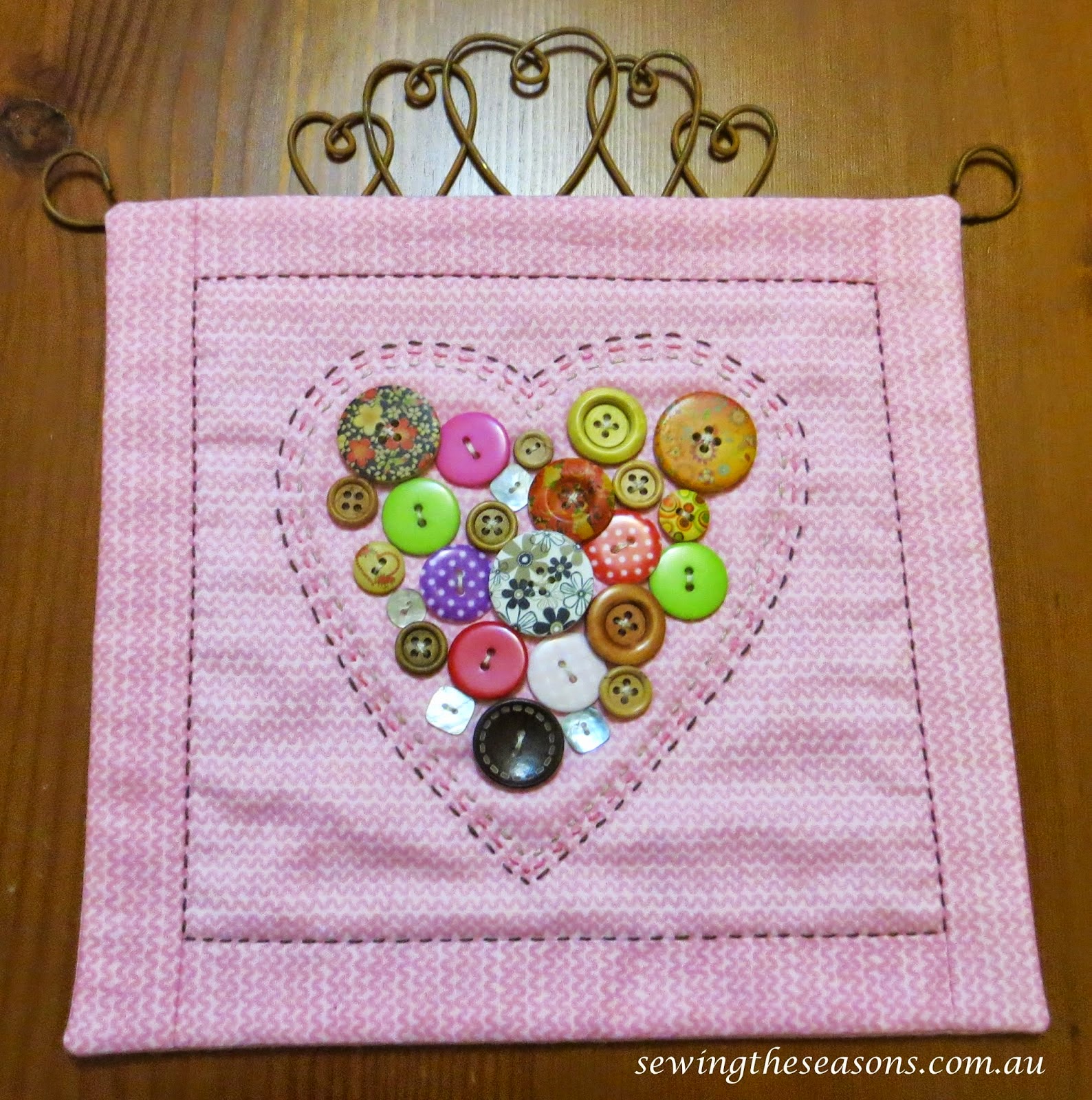 http://www.sewingtheseasons.com.au/2015/01/tutorial-button-heart-hangings.html