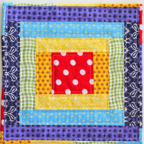 http://thecraftymummy.com/2014/08/rainbow-mini-quilt-tutorial/