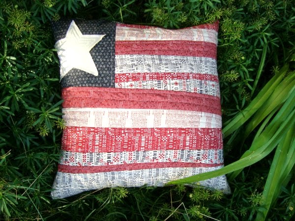 http://www.patchworkposse.com/2014/06/flag-pillow-tutorial-quilt-as-you-go-technique/