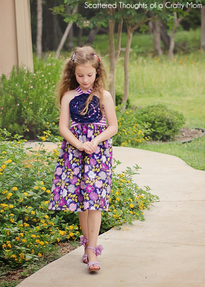 http://www.scatteredthoughtsofacraftymom.com/2014/06/ruffled-flower-sundress-free-pattern.html