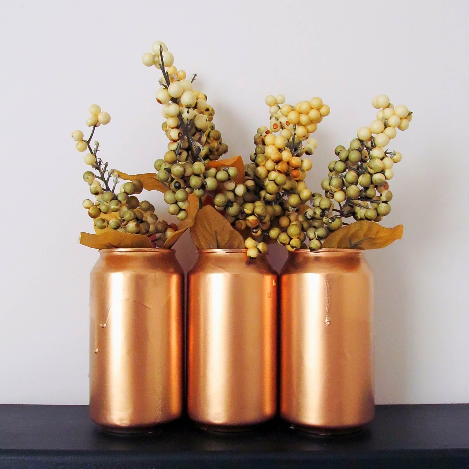 http://muslinandmerlot.blogspot.com/2014/05/soda-can-vase-or-cup.html