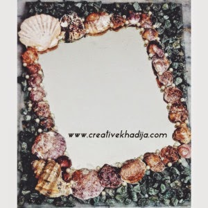 http://creativekhadija.com/2014/04/mirror-decoration-shells-stones/