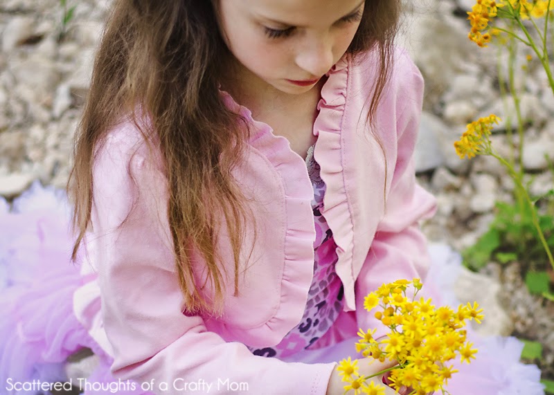 http://www.scatteredthoughtsofacraftymom.com/2014/04/girls-cropped-ruffled-cardigan-pattern.html