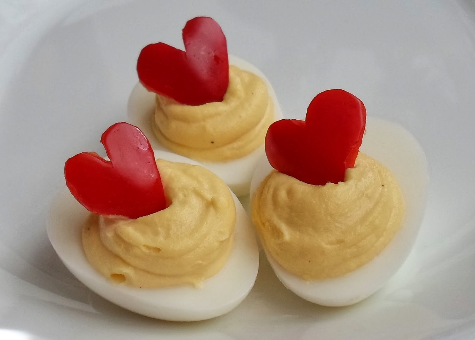 http://happierthanapiginmud.blogspot.com/2014/01/red-bell-pepper-heart-deviled-eggs.html