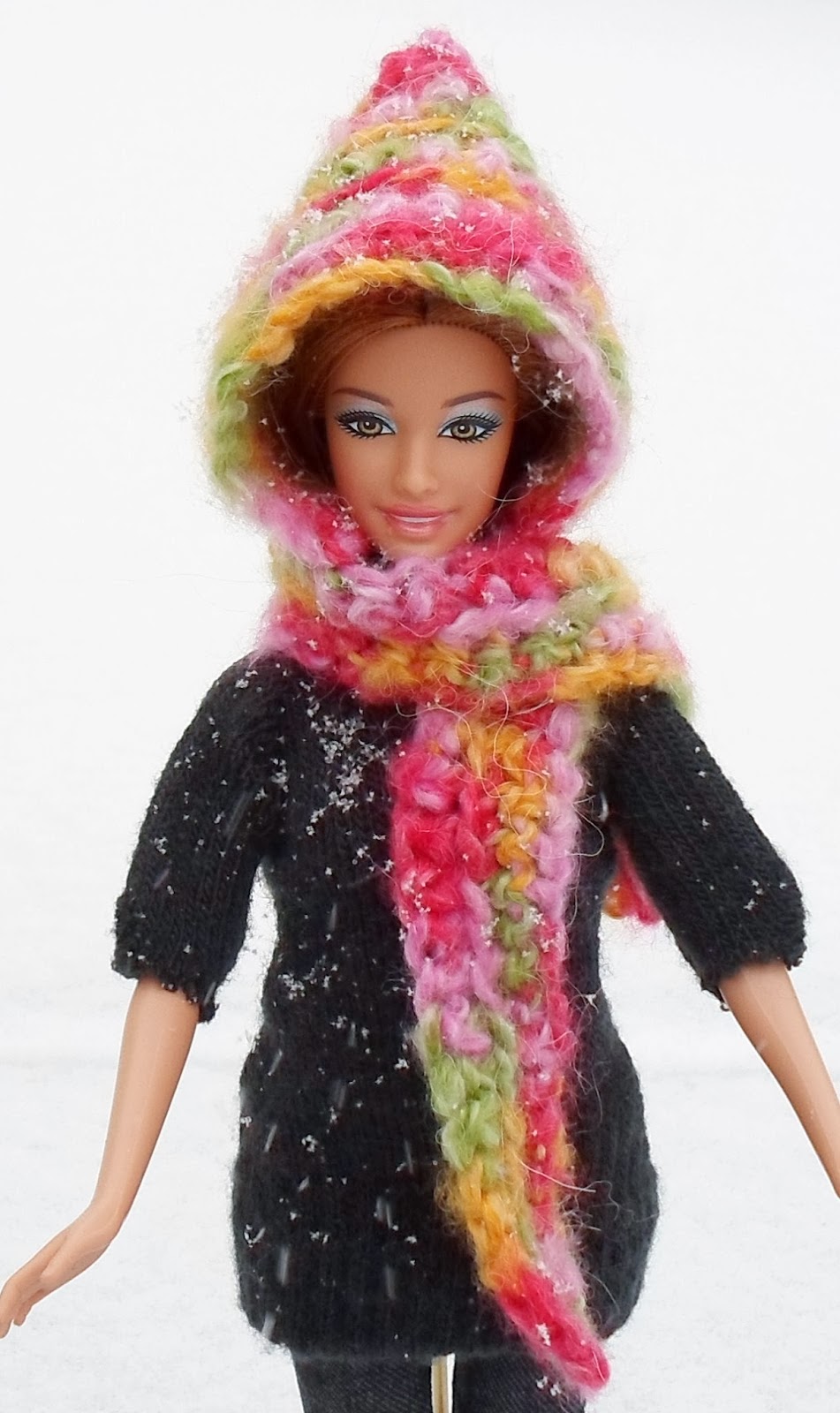 http://happierthanapiginmud.blogspot.com/2014/01/easy-hooded-scarf-for-barbie-crochet.html