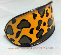 http://koltureshoq.wordpress.com/2013/11/28/turn-your-sunglasses-case-into-a-leopard-print-clutch-bag-awesome-diy/