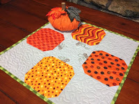 http://www.sassyquilter.com/pumpkin-table-topper-tutorial/