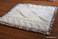 http://maidenjane.blogspot.com/2013/11/upcycled-knit-sweater-hot-pad-or-trivet.html